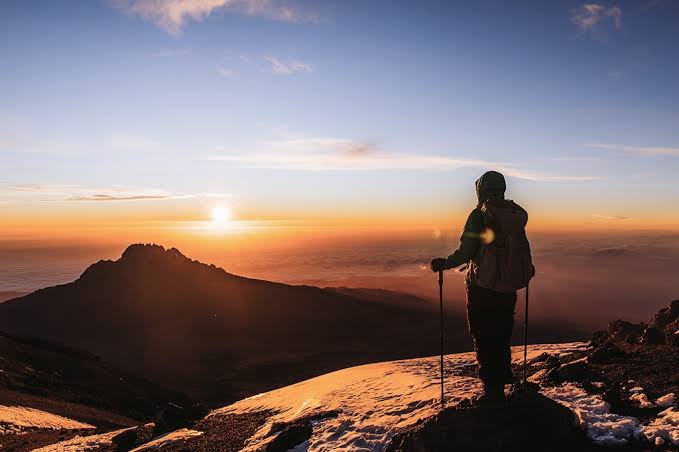 Polish-speaking mountain guide with trekkers on the Machame Route to Kilimanjaro